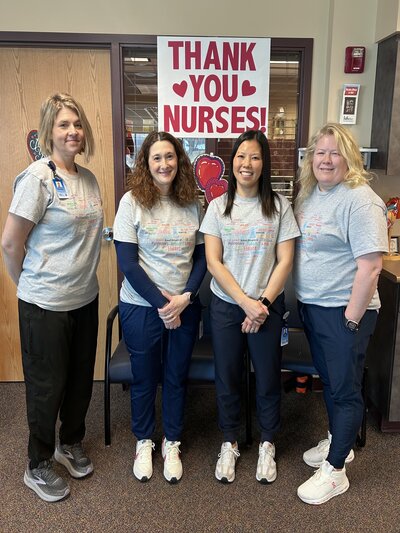 Pictured is four of the Pulmonanry Rehab staff members standing in an office, smiling. There is a sign behind them that reads &quot;Thank you Nurses&quot;.