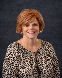 Female Horn Physician smiling