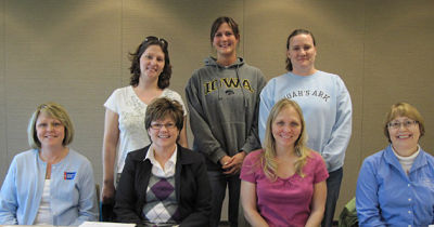 Group of women smiling. There is Seven females.