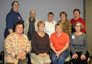 Group photo of Hospice Volunteers. There is eight females and one male