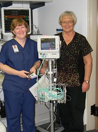 Two females are standing next to new equipment at Horn Memorial Hospital